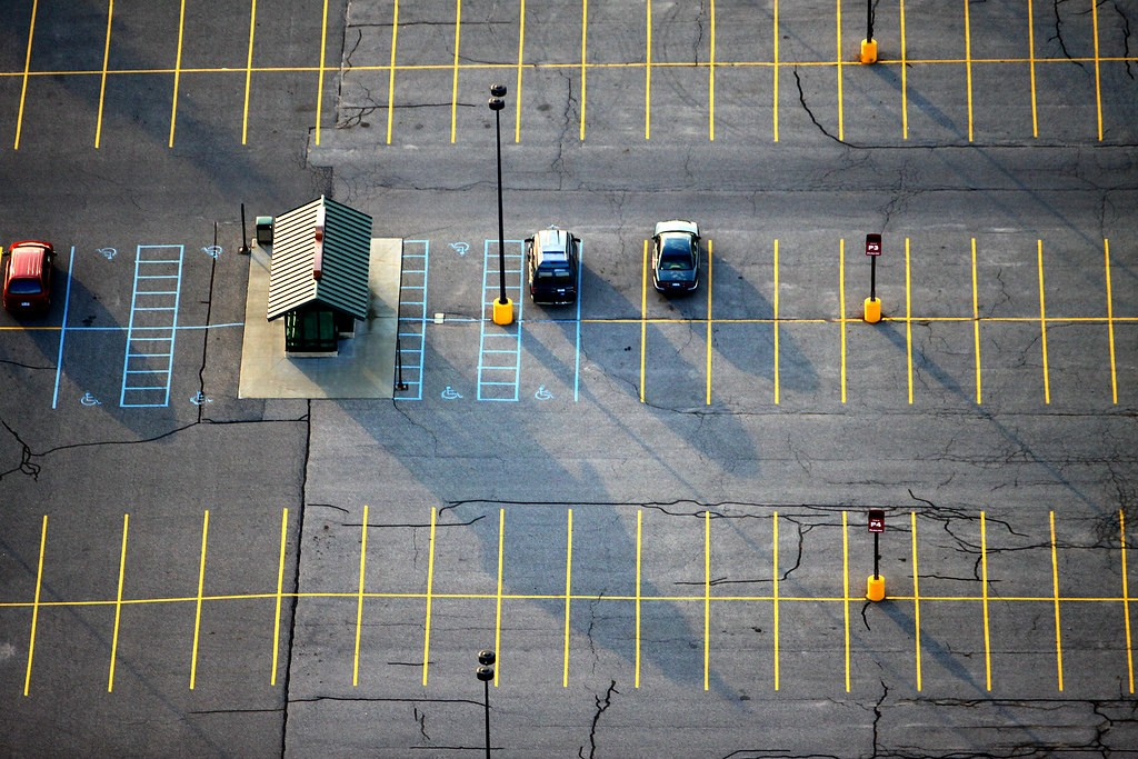 A birds eye view of a mostly empty parking lot